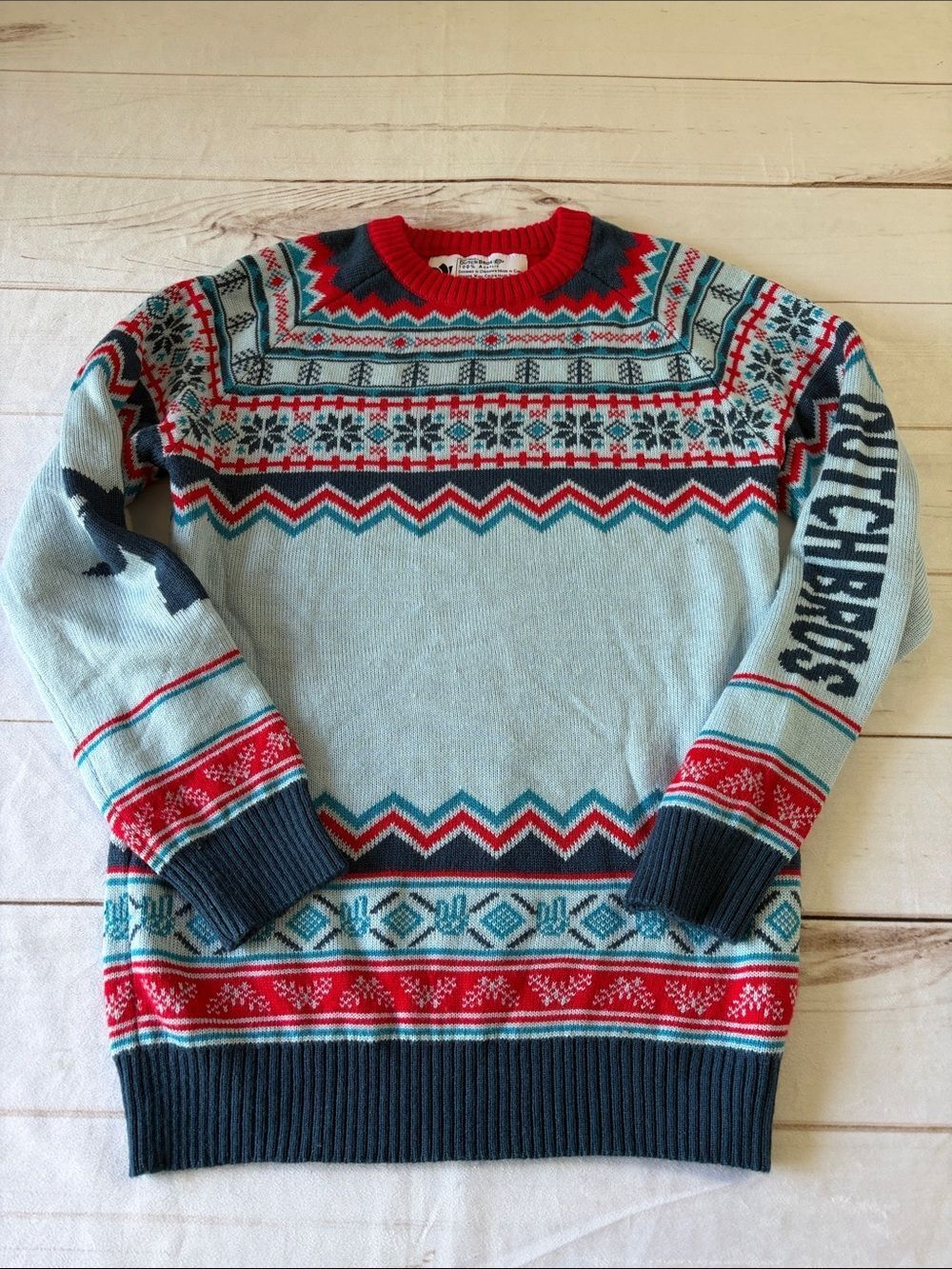 Dutch Bros Light Blue Fair Isle Crewneck with Red and Navy Accents